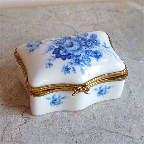 small blue metal trinket box with hinged lid|ceramic decorative box with lids.